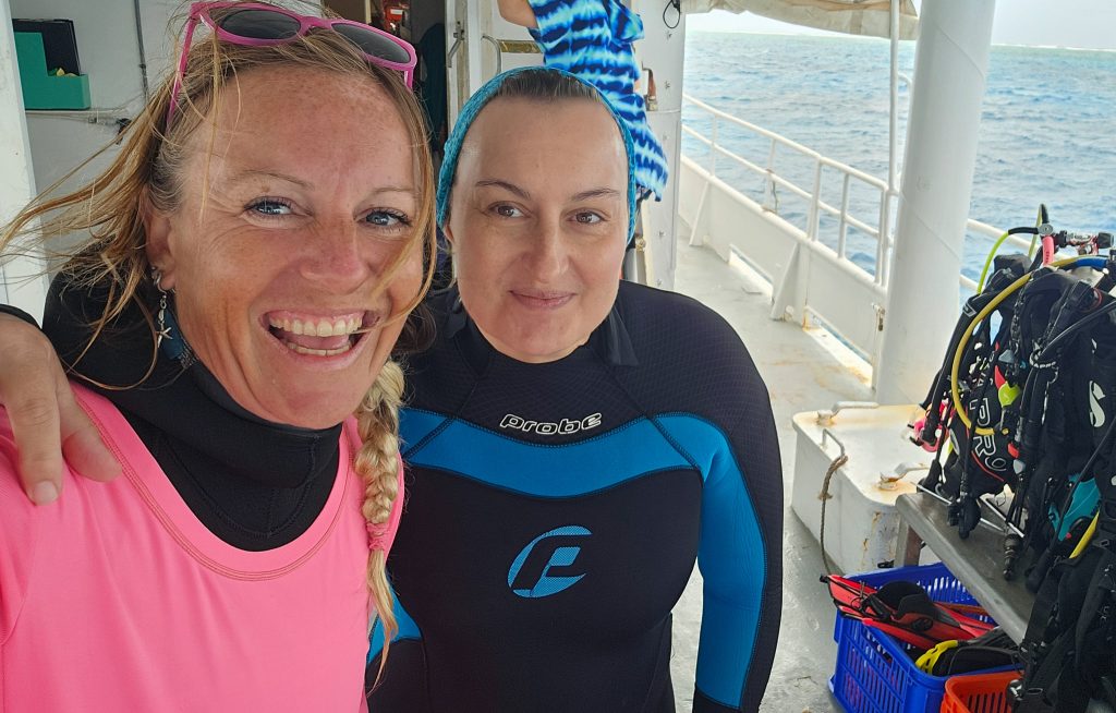 Jenn Mayes (in pink) with her buddy Nadine Huth on the dive deck of the MV Sea Esta.